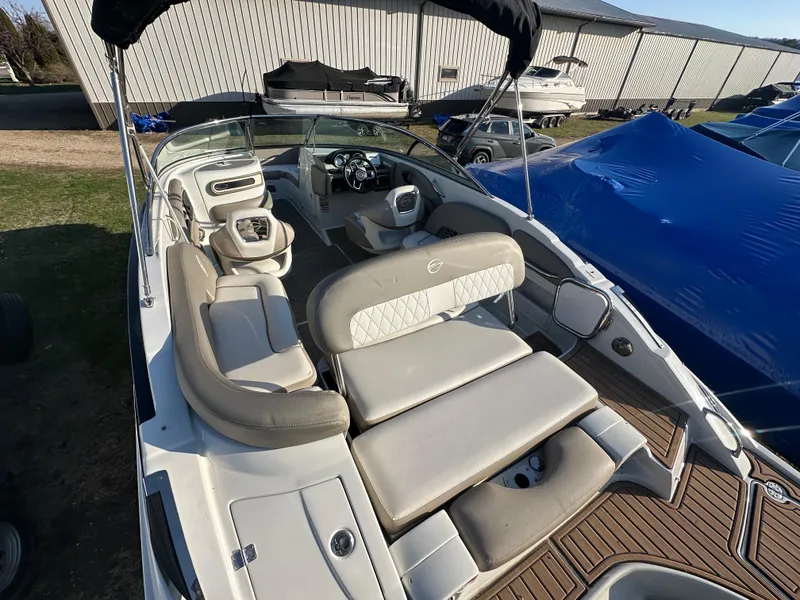 Slide: The Image of 2019 Crownline Eclipse E235 XS boat with spacious seating and modern design. - 10