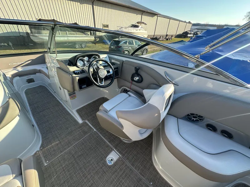 Slide: The Image of 2019 Crownline Eclipse E235 XS boat interior with steering wheel and seating. - 12