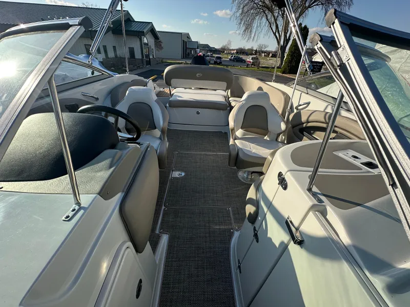Slide: The Image of 2019 Crownline Eclipse E235 XS boat interior with seating and steering wheel. - 17
