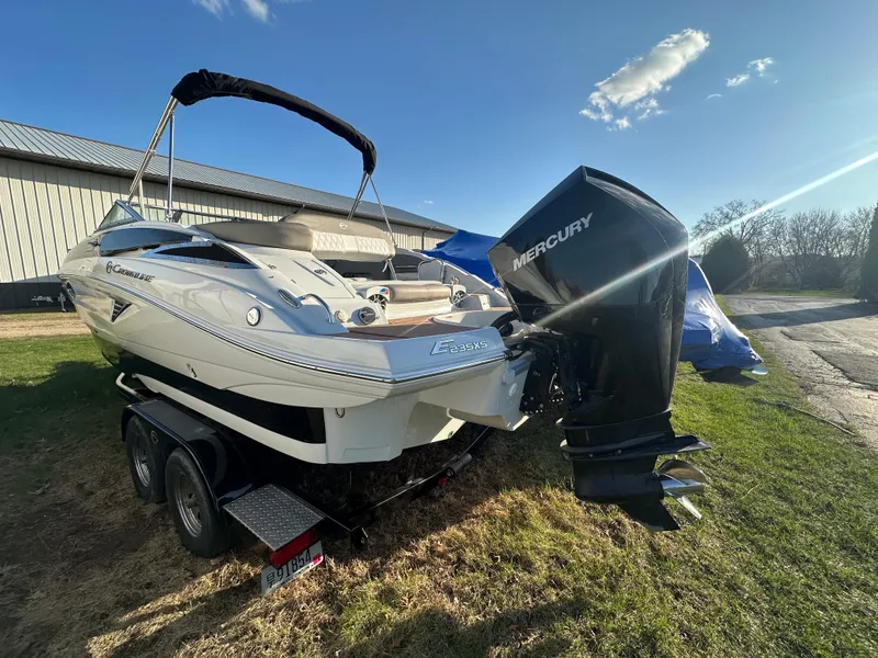 Slide: The Image of 2019 Crownline Eclipse E235 XS boat with Mercury outboard engine on trailer. - 3