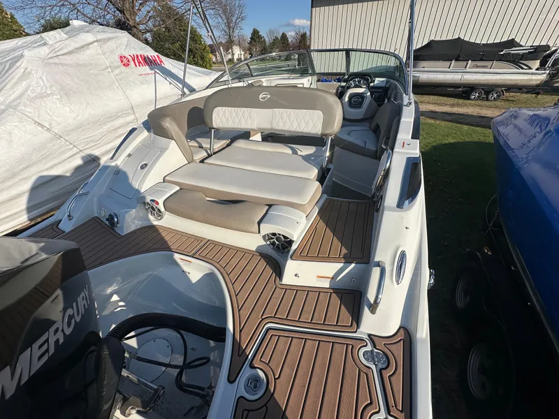 Slide: The Image of 2019 Crownline Eclipse E235 XS boat with spacious seating and modern interior design. - 8