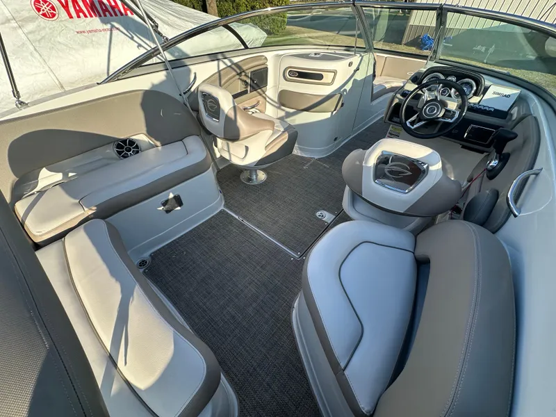 Slide: The Image of 2019 Crownline Eclipse E235 XS boat interior with modern seating and steering console. - 9