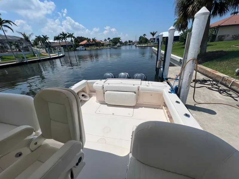 Slide: The Image of 2006 Grady-White 360 Express boat docked by a scenic waterfront. - 10