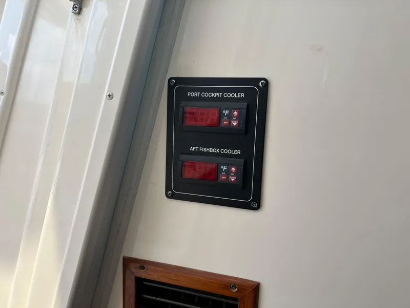 Slide: The Image of Control panel on 2006 Grady-White 360 Express boat, showing cooler temperature settings. - 12