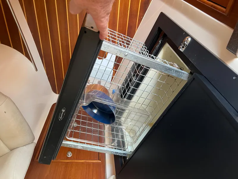 Slide: The Image of Open refrigerator drawer on 2006 Grady-White 360 Express boat interior. - 24