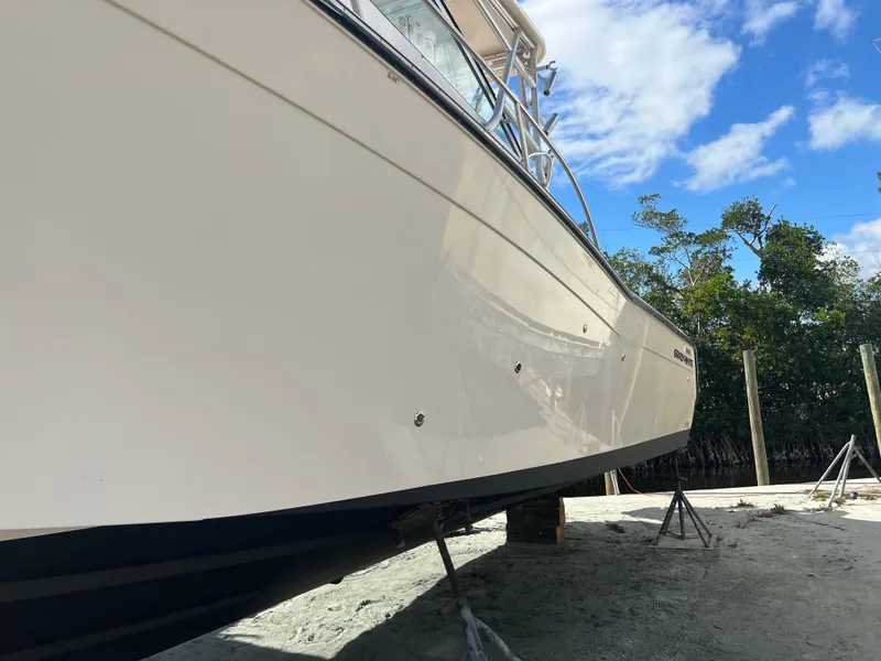 Slide: The Image of 2006 Grady-White 360 Express boat on stands, side view, clear sky background. - 29