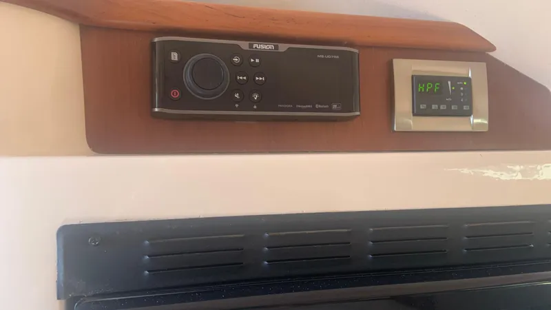 Slide: The Image of Control panel and display inside a 2006 Grady-White 360 Express boat cabin. - 37