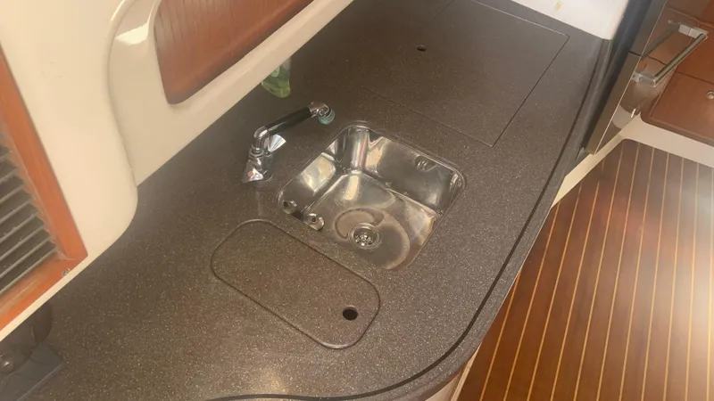 Slide: The Image of 2006 Grady-White 360 Express boat interior with sink and countertop. - 40