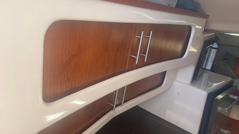 Slide: The Image of 2006 Grady-White 360 Express interior with wooden cabinets and modern design. - 41