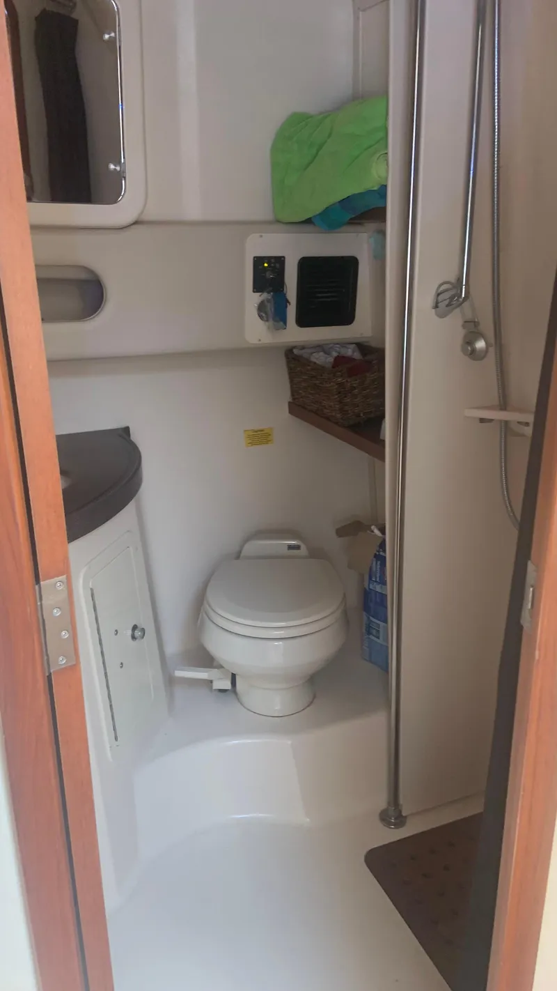 Slide: The Image of 2006 Grady-White 360 Express boat bathroom interior with toilet and shower. - 42