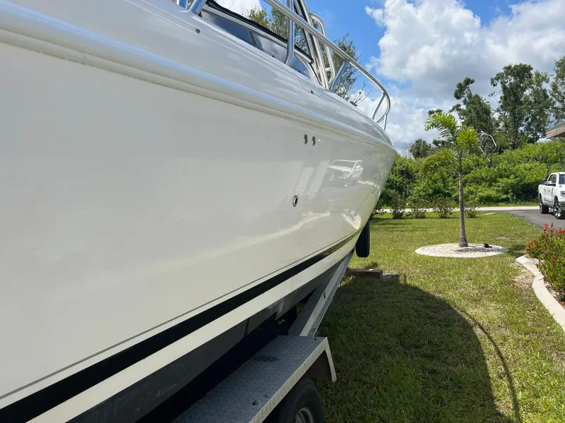 Slide: The Image of 2009 Intrepid 310 WA boat on trailer, side view, sunny day. - 21