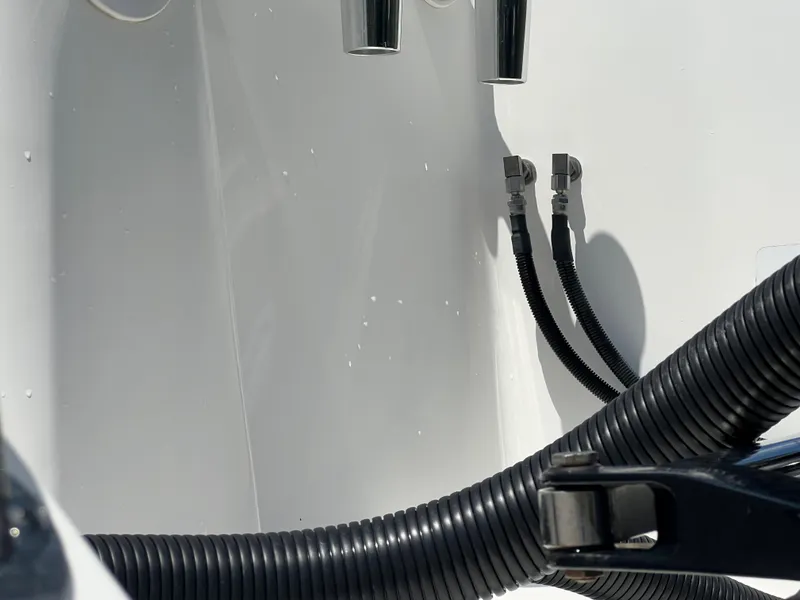 Slide: The Image of Close-up of 2009 Intrepid 310 WA boat's engine hoses and fittings. - 25