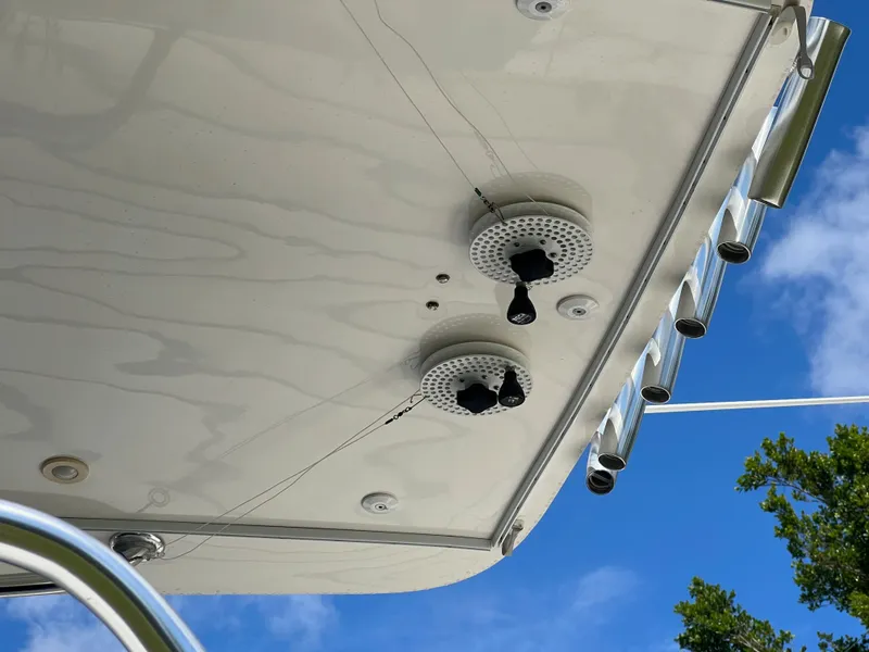 Slide: The Image of Underside view of a 2009 Intrepid 310 WA boat with speakers and rod holders. - 27