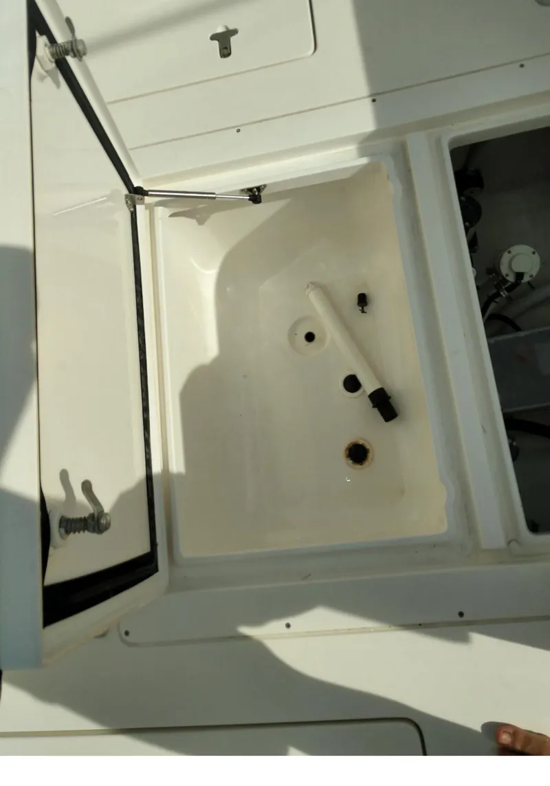 Slide: The Image of Open storage compartment on a 2009 Intrepid 310 WA boat. - 7