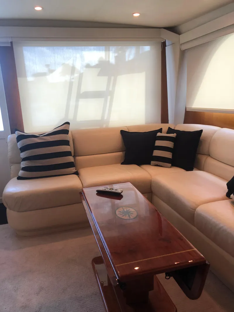 Slide: The Image of Luxurious interior of 1998 Viking 43 Convertible yacht with plush seating and striped cushions. - 14
