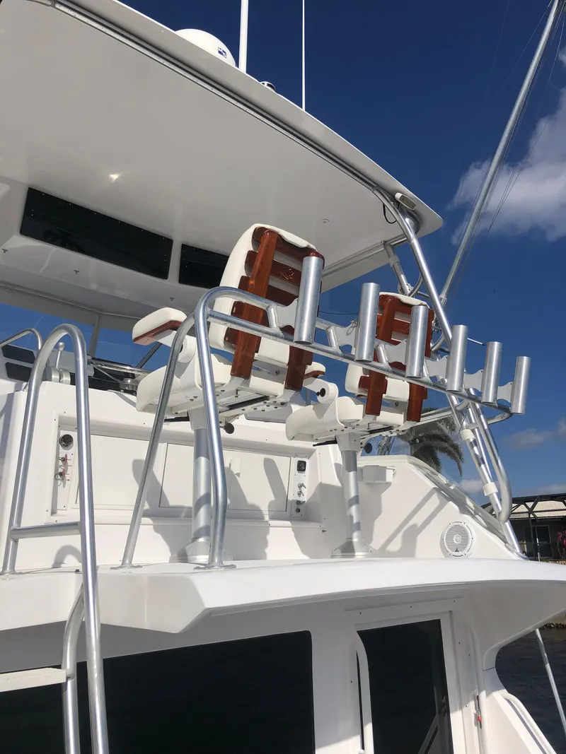 Slide: The Image of 1998 Viking 43 Convertible yacht with upper deck and fishing rod holders. - 28