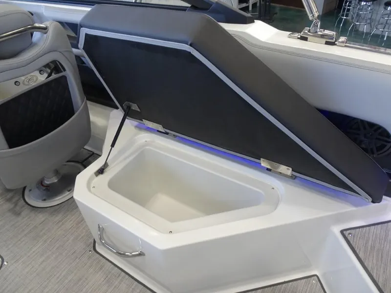 Slide: The Image of 2025 Cobalt R4 boat interior with open storage compartment and seating. - 14