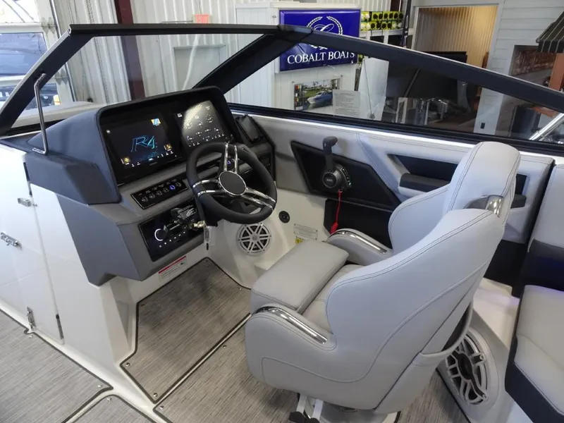 Slide: The Image of 2025 Cobalt R4 boat interior with modern dashboard and steering wheel. - 15