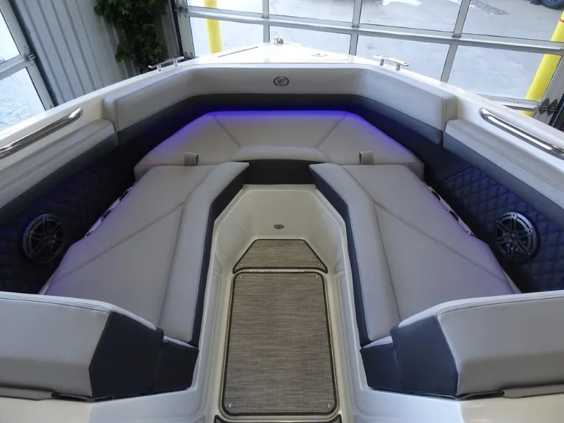 Slide: The Image of 2025 Cobalt R4 boat interior with plush seating and ambient lighting. - 22