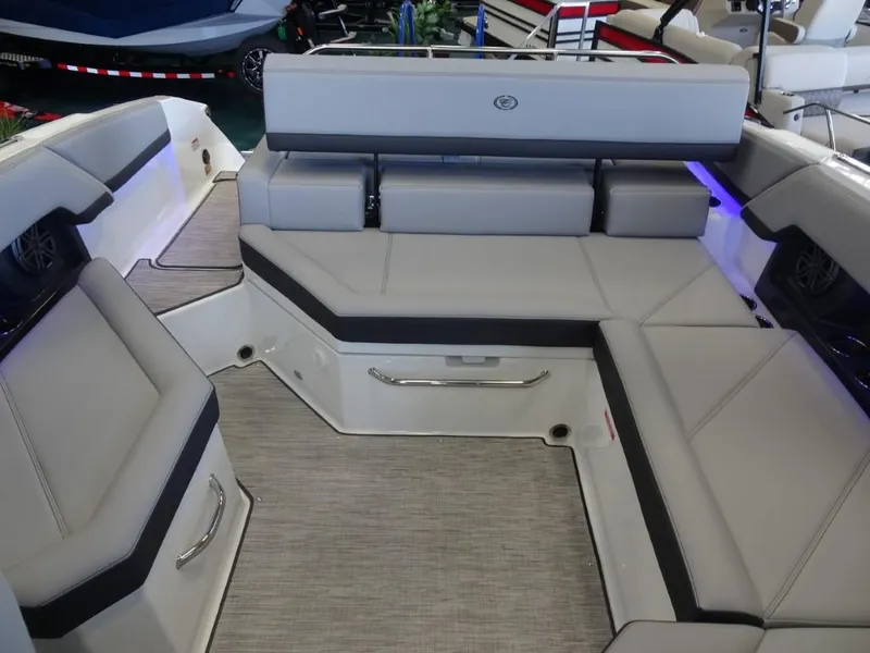 Slide: The Image of 2025 Cobalt R4 boat interior with gray seating and modern design. - 24