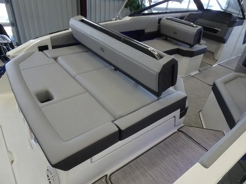Slide: The Image of 2025 Cobalt R4 boat interior with luxurious gray seating and modern design. - 8