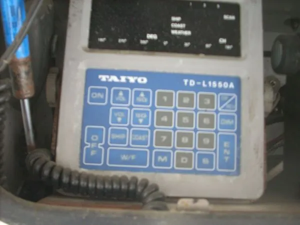 Slide: The Image of An electronic device with a keypad and screen, possibly a radio or navigation system. - 30