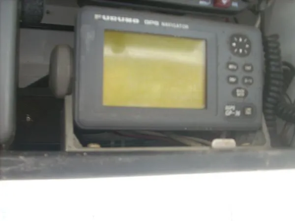 Slide: The Image of A Furuno GPS navigator is installed in a boat, surrounded by other electronic equipment. - 31