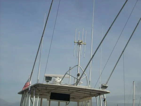 Slide: The Image of The image shows the roof of a 2000 Duffy Flybridge Sportfisherman with antennas and a U.S. flag. - 37