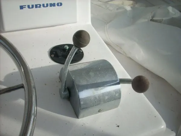 Slide: The Image of Close-up of a throttle lever on a boat with Furuno equipment. - 35