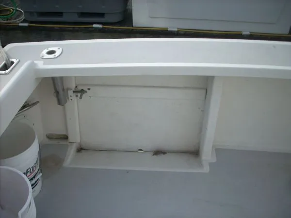 Slide: The Image of The image shows the cockpit of a 2000 Duffy Flybridge Sportfisherman with a clean, white deck. - 15