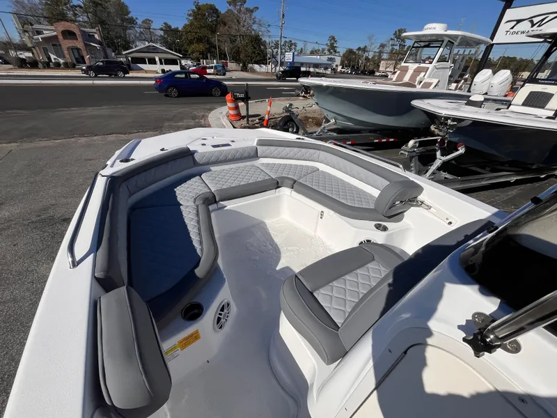 Slide: The Image of 2025 NauticStar 211 Hybrid boat with spacious seating and modern design. - 12