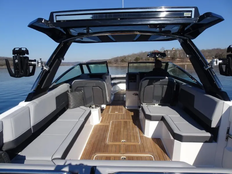 Slide: The Image of 2025 Cobalt R33 Surf boat interior with sleek seating and wooden flooring. - 10