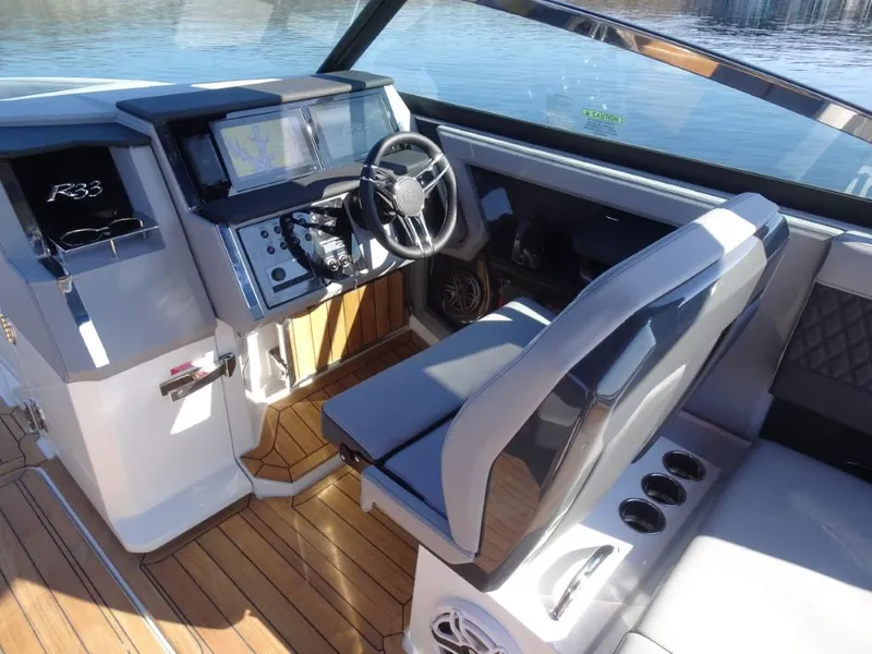 Slide: The Image of 2025 Cobalt R33 Surf boat interior with modern dashboard and seating. - 19