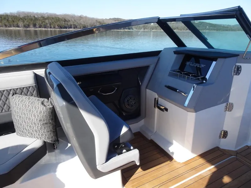 Slide: The Image of Interior of 2025 Cobalt R33 Surf boat with modern seating and dashboard. - 23
