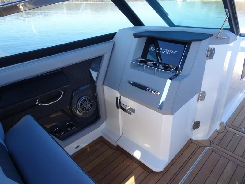 Slide: The Image of Interior of 2025 Cobalt R33 Surf boat with sleek design and wood flooring. - 25