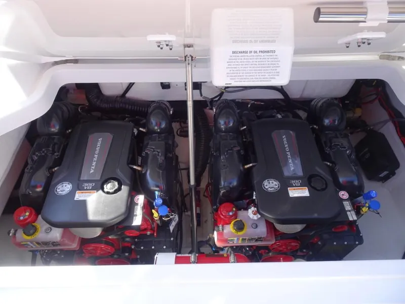 Slide: The Image of Twin engines in a 2025 Cobalt R33 Surf boat, showcasing powerful marine performance. - 33