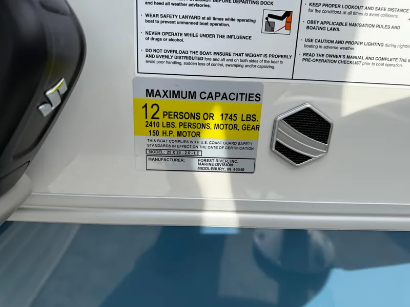 Slide: The Image of 2025 South Bay 224RS LE boat capacity label, 12 persons or 1745 lbs, 150 HP motor. - 16