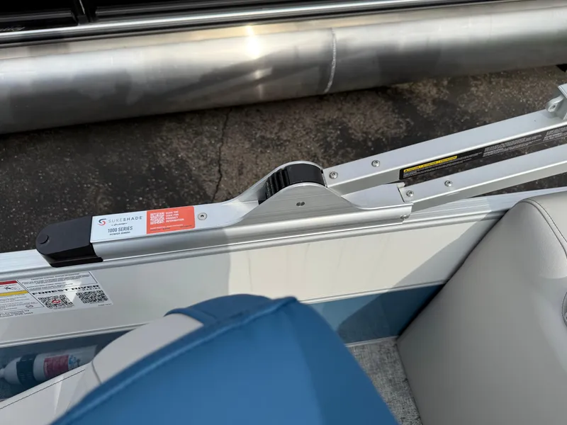 Slide: The Image of Interior view of a 2025 South Bay 224RS LE pontoon boat, featuring seating and railing details. - 21