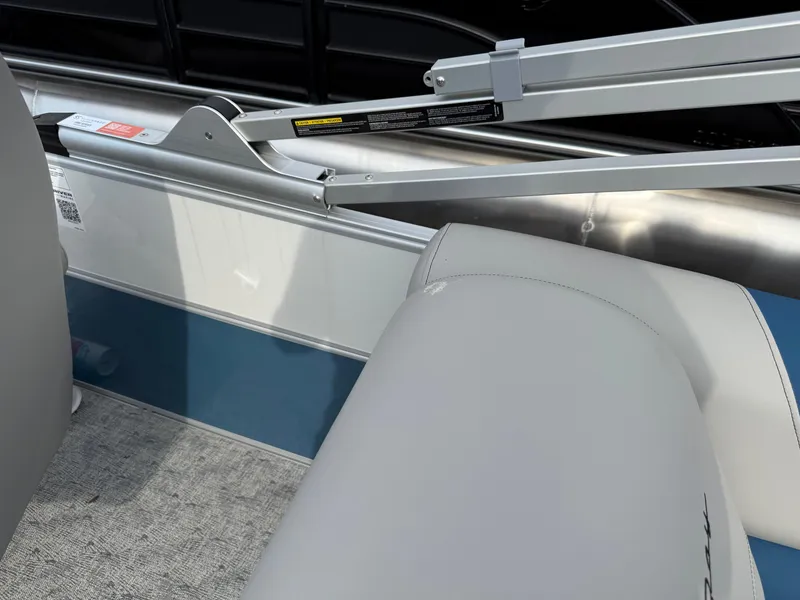 Slide: The Image of 2025 South Bay 224RS LE boat interior with gray seating and blue accents. - 22
