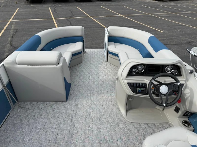 Slide: The Image of 2025 South Bay 224RS LE pontoon boat interior with modern seating and steering console. - 23
