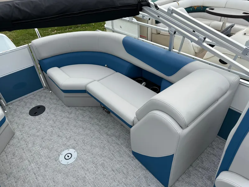 Slide: The Image of 2025 South Bay 224RS LE boat interior with blue and gray seating. - 25