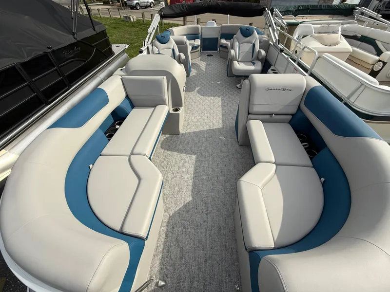 Slide: The Image of 2025 South Bay 224RS LE pontoon boat with spacious seating and modern design. - 9