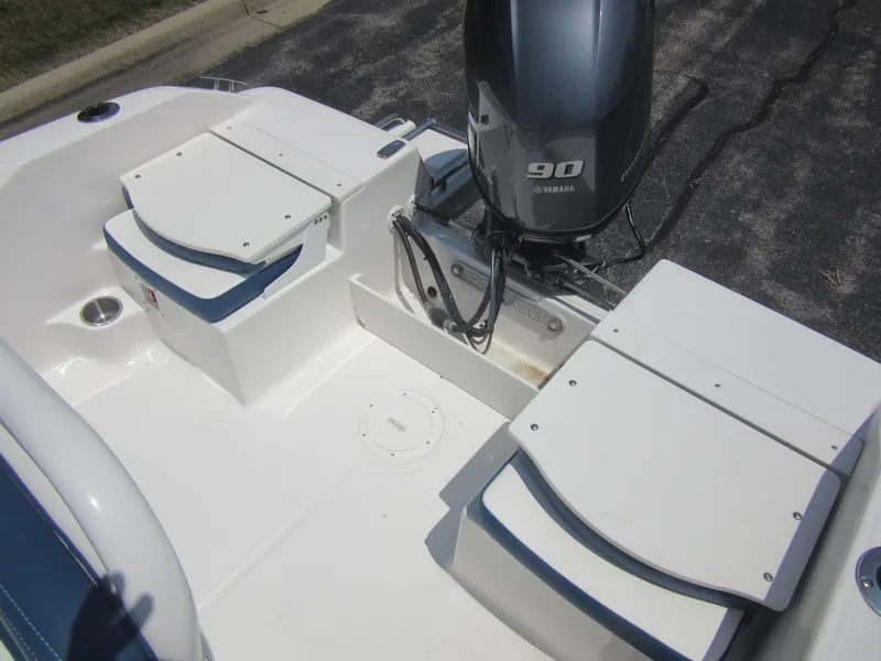 Slide: The Image of 2025 Robalo R160 Center Console boat with Yamaha 90 engine, featuring spacious seating. - 13