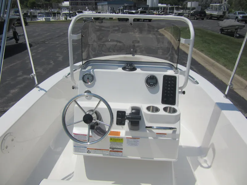 Slide: The Image of 2025 Robalo R160 Center Console boat interior with steering wheel and control panel. - 15