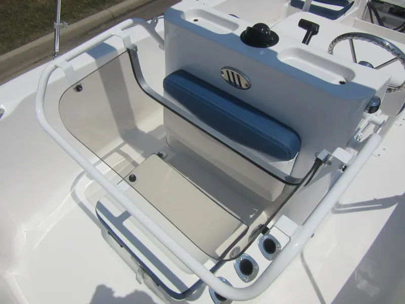 Slide: The Image of 2025 Robalo R160 Center Console boat interior with seating and steering wheel. - 17