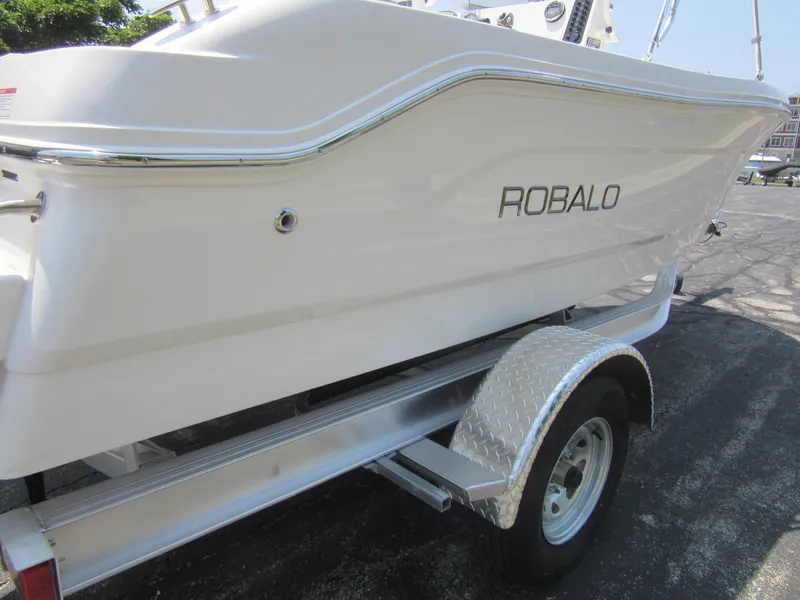 Slide: The Image of 2025 Robalo R160 Center Console boat on trailer, side view. - 3
