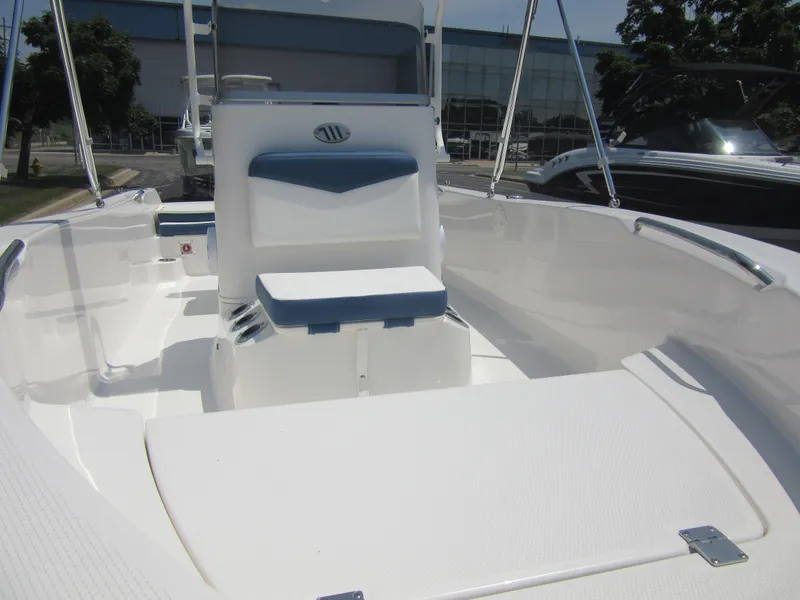 Slide: The Image of 2025 Robalo R160 Center Console boat with sleek white interior design. - 5