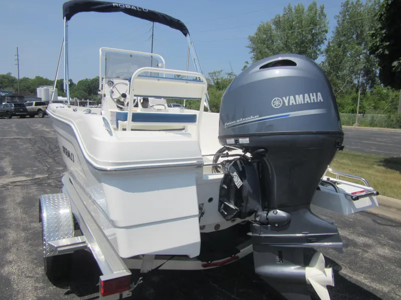 Slide: The Image of 2025 Robalo R160 Center Console boat with Yamaha outboard motor on trailer. - 9
