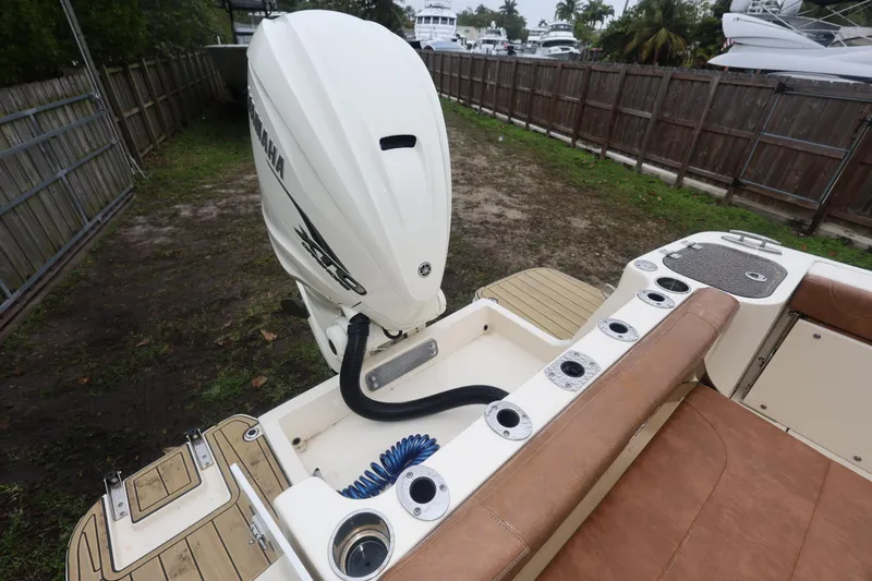 Slide: The Image of 2023 Scout 255 Dorado boat with Yamaha outboard engine, featuring a spacious deck and seating area. - 48