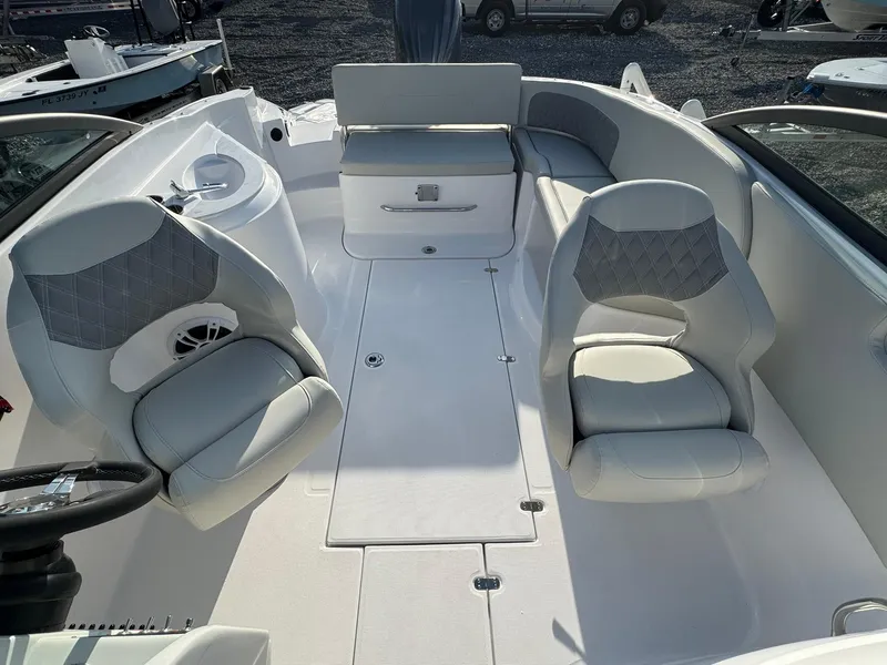 Slide: The Image of 2025 SouthWind 2600 boat interior with white seating and modern design. - 10